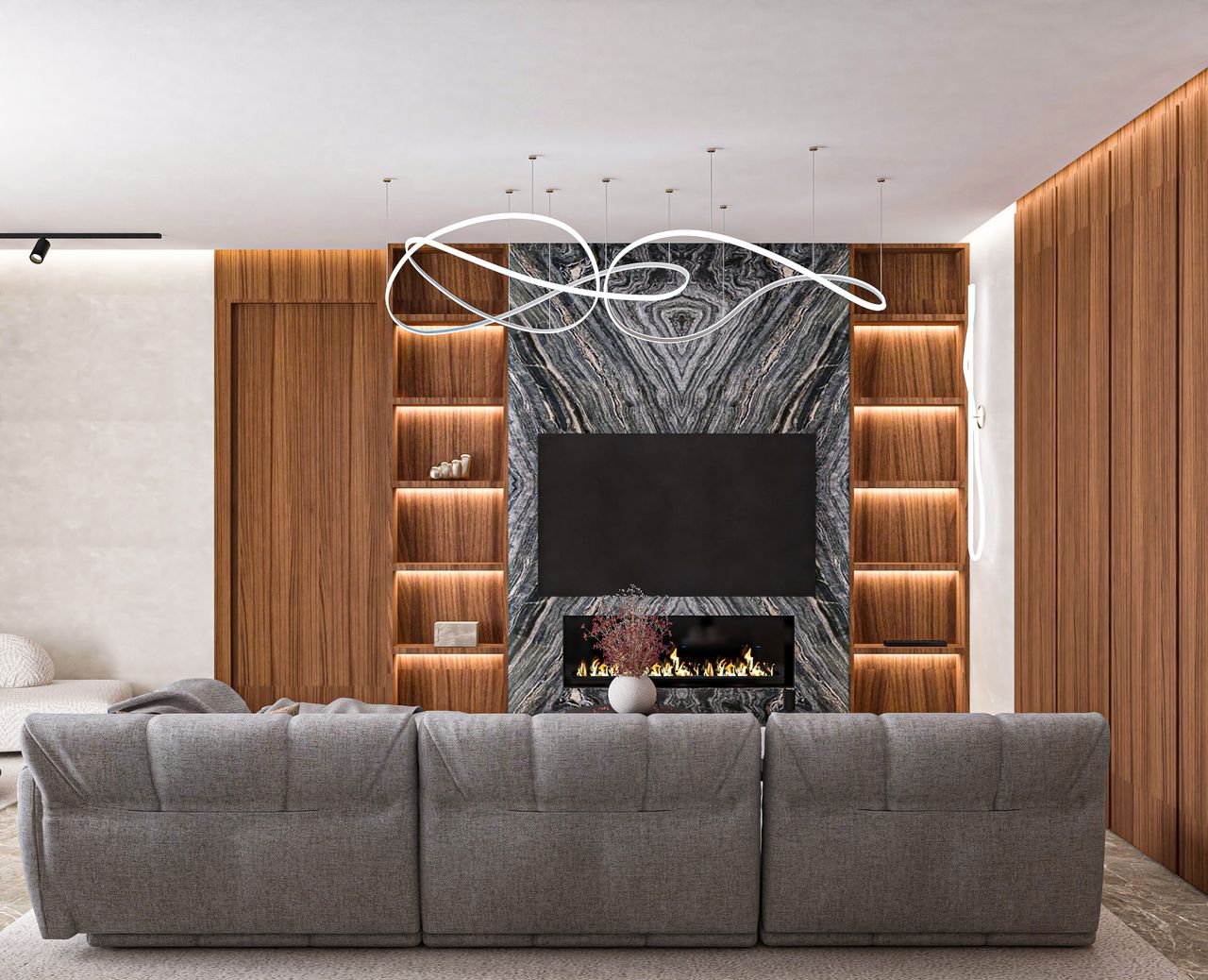about-hero Elegant living room with modern fireplace, grey sofa, and wooden design elements.